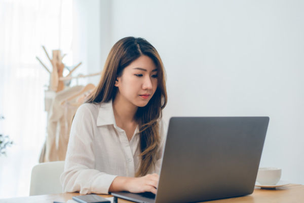 beautiful-young-smiling-asian-woman-working-laptop-while-home-office-work-space_7861-914.jpg