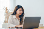 beautiful-young-smiling-asian-woman-working-laptop-while-home-office-work-space_7861-914.jpg